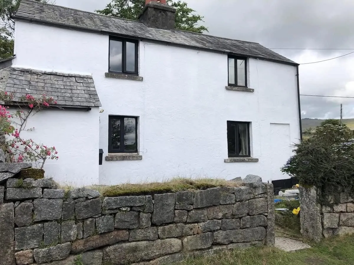 Render repair and exterior repaint of a cottage in Budleigh Salterton
